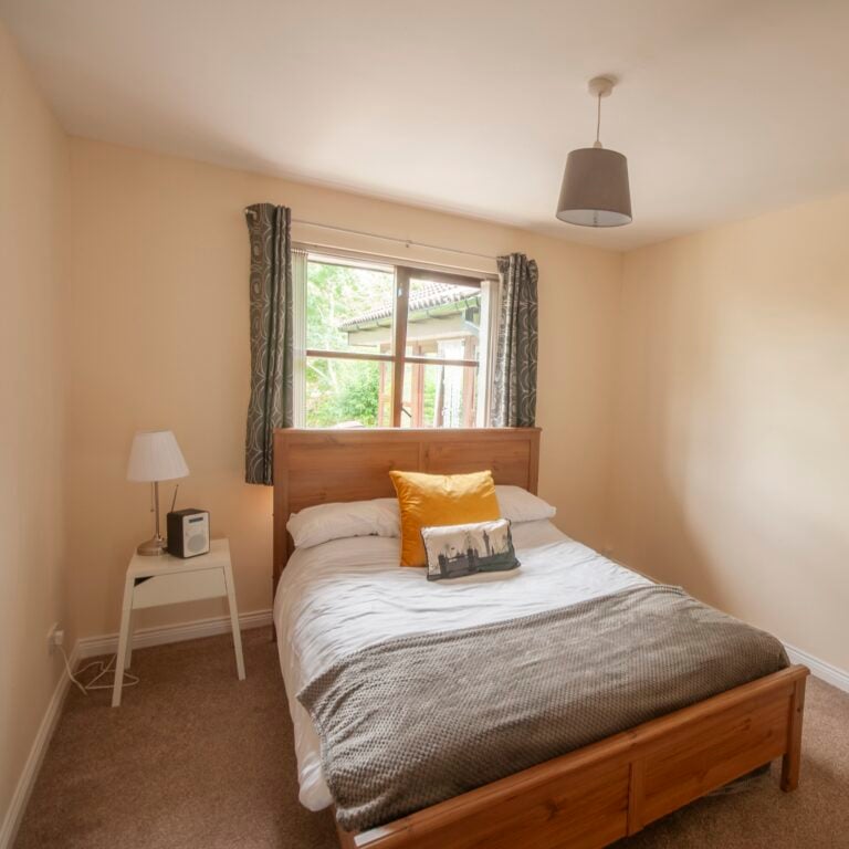 Double bed in the spare room of a modern bungalow