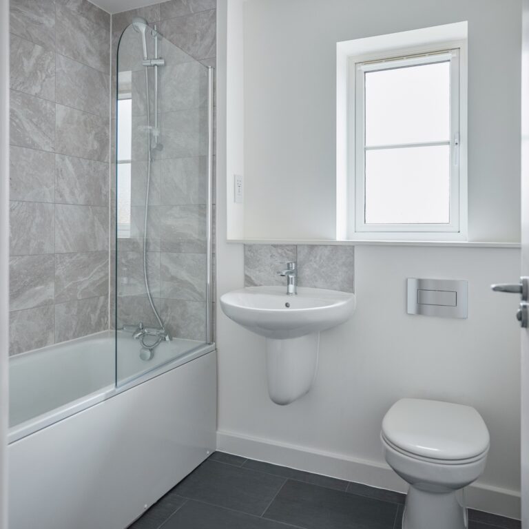 Empty Modern Bathroom With Shower Fitted In New Home On Moving In Day