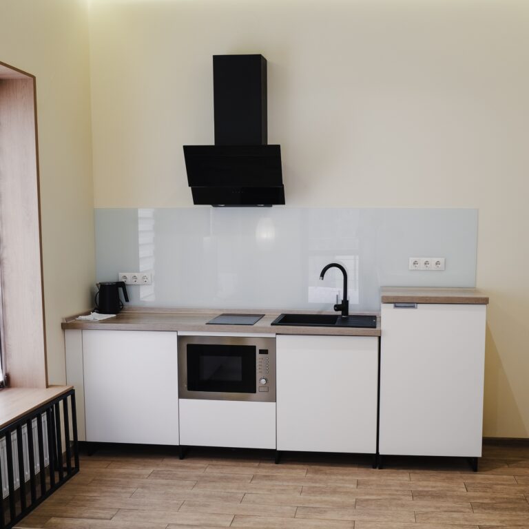 Interior of a studio kitchen in a country hotel room.